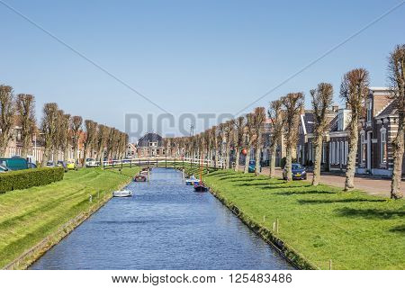 STAVOREN, NETHERLANDS - APRIL 11, 2016: Canal with little boats in the center of Stavoren, Holland