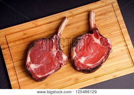 Raw Dry aged tender delicious Tomahawk Steak