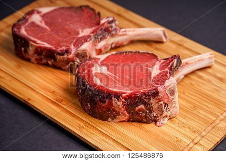 Raw Dry aged tender delicious Tomahawk Steak