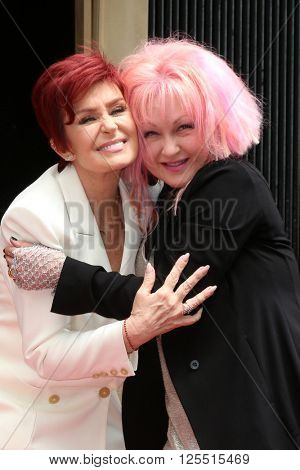 LOS ANGELES - APR 11:  Sharon Osbourne, Cyndi Lauper at the Harvey Fierstein and Cyndi Lauper Hollywood Walk of Fame Ceremony at the Pantages Theater on April 11, 2016 in Los Angeles, CA