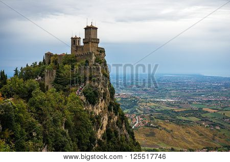 Rocca della Guaita fortress on Mount Titano Titan Mount with aerial view of Italian countryside landscape below. San Marino