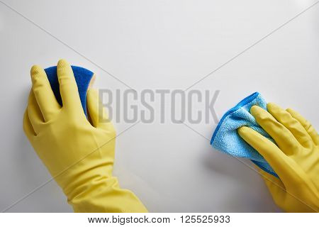 Hands Of Cleaning Staff With Rag And Scourer Working