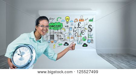 Delighted businesswoman holding a clock against large white screen