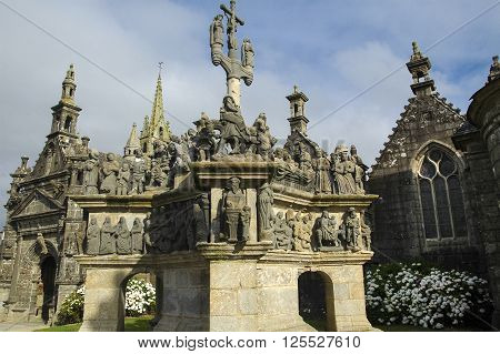 Guimiliau (Finistere Brittany France): the medieval church with the typical stone calvary