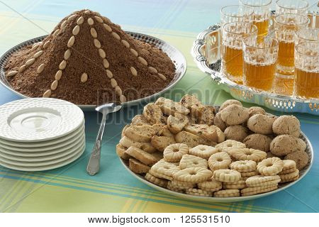 Dishes with Moroccan festive homemade cookies, selou and tea