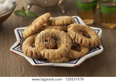 Traditional crunchy Moroccan fekkas cookies on a dish close up