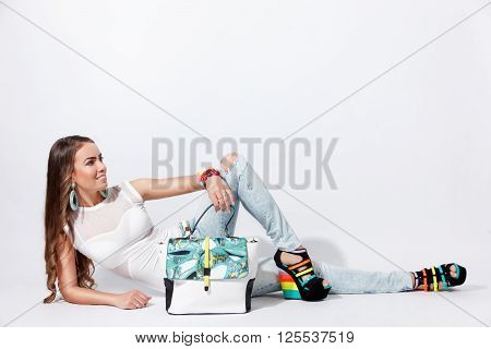 Pretty fashion model posing in the studio