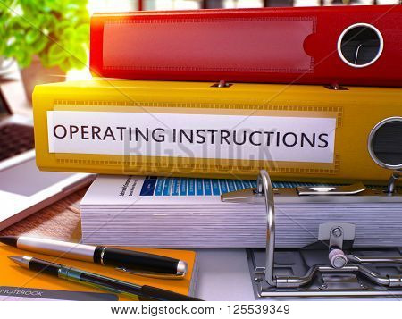 Yellow Ring Binder with Inscription Operating Instructions on Background of Working Table with Office Supplies and Laptop. Operating Instructions Business Concept on Blurred Background. 3D Render.