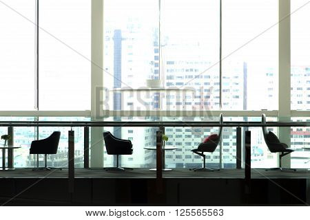 abstract silhouette business chair and desk on bacony on skycrapter