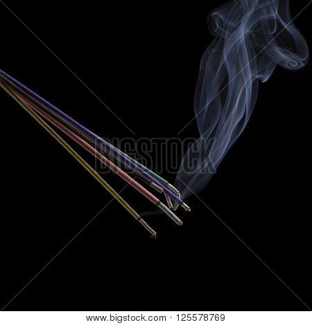 Burning incense sticks with smoke isolated on black