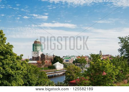 Vyborg castle. Medieval Swedish castle with St. Olav tower during reconstruction. Summer day in in Vyborg Russia.