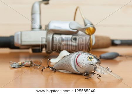a set of fishing lures on a wooden background