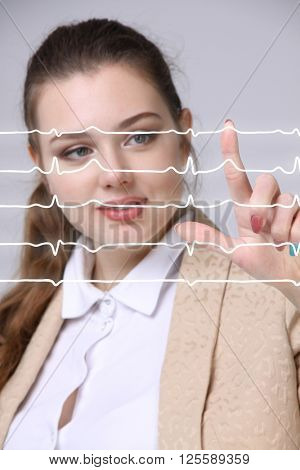 Doctor woman working with cardiogram lines