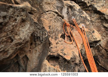 closeup of rock climbing rope on rockwall