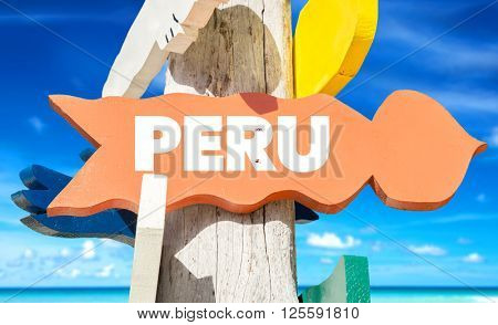 Peru signpost with beach background