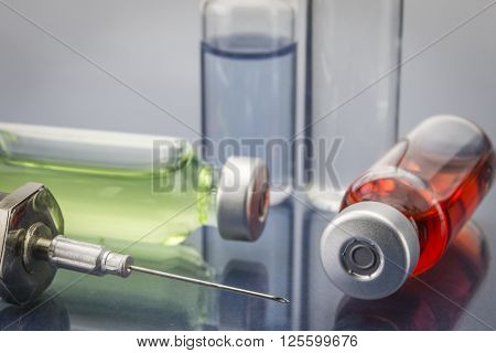 Diagnosis - Treatment and prevention. Medical Report with Composition of Medicaments - Vials Injections and Syringe. Selective Focus