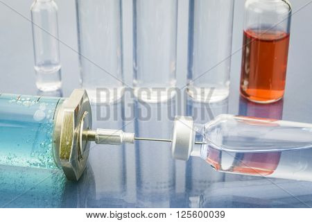 Diagnosis - Treatment and prevention. Medical Report with Composition of Medicaments - Vials Injections and Syringe. Selective Focus