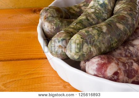 Assorted pork sausages on a wooden table
