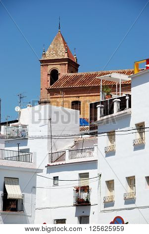 Townhouses with the church to the rear Torrox Malaga Province Andalucia Spain Western Europe.