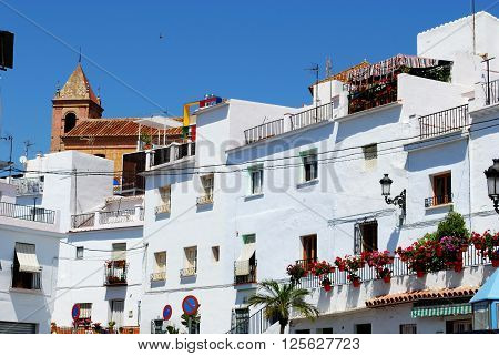 Townhouses with the church to the rear Torrox Malaga Province Andalucia Spain Western Europe.