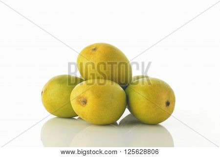 High resolution image of fresh Alphonso mangoes over white background shot in studio.