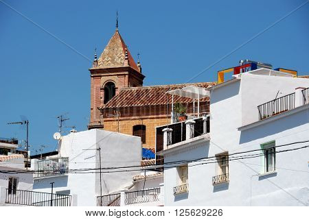 Townhouses with the church to the rear Torrox Malaga Province Andalucia Spain Western Europe.