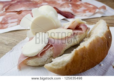 traditional Italian oil sandwch stuffed with ham steak and provola