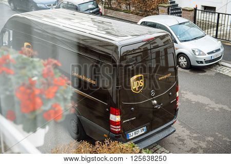 PARIS FRANCE - DEC 10 2015: UPS United Parcel Service van delivery brown ups van after dlivering the on time delivering package parcel