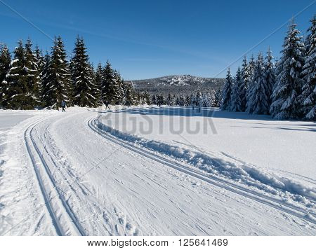 Sunny day on winter mountains with groomed cross-country trails, Jizera Mountains, Czech Republic