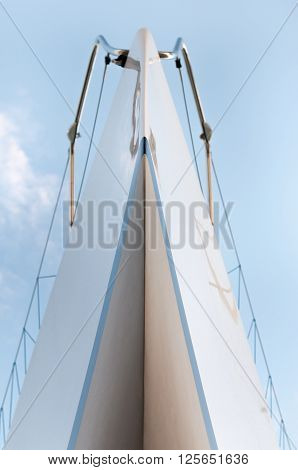 Yacht from the bottom view with blue sky behind