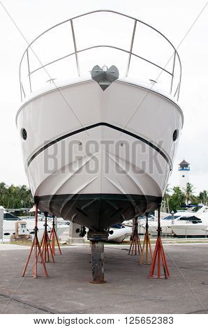 Small motorboat waiting for a maintenance at a shipyard