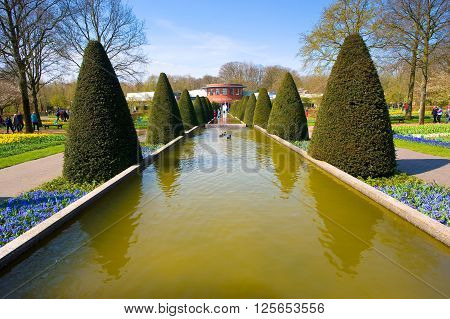 LISSE THE NETHERLANDS APRIL 11 2016: Tourists are visiting 'the Keukenhof'in the spring. The Keukenhof is a popular flower garden which is visited by a million tourists from all around the world. It is open for only six weeks every year.