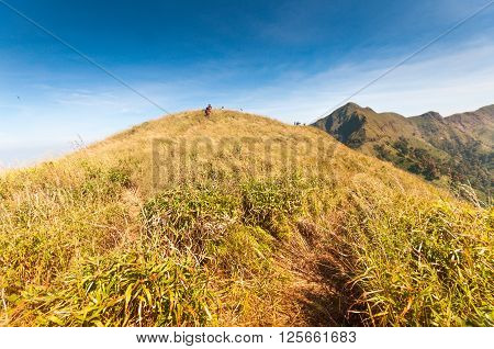 Tourists hiking at Khao Chang Puak mountain Kanchanaburi Thailand