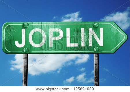 joplin road sign on a blue sky background
