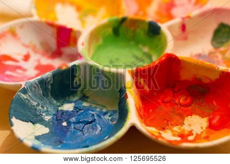 a color palette on table with happy