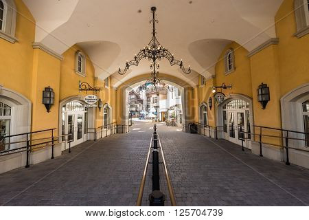 Vail, USA - September 10, 2015: Arched Pathway with railing to the shopping area at Lionshead Place in Vail, Colorado, USA.