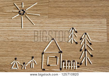 Image of matches on the wooden background
