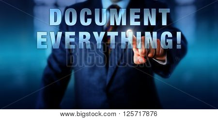 Manager is touching DOCUMENT EVERYTHING! on a virtual touch screen interface. Business challenge metaphor and information technology concept for regulatory compliance requirements.