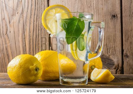 Glass of water on old  wooden background