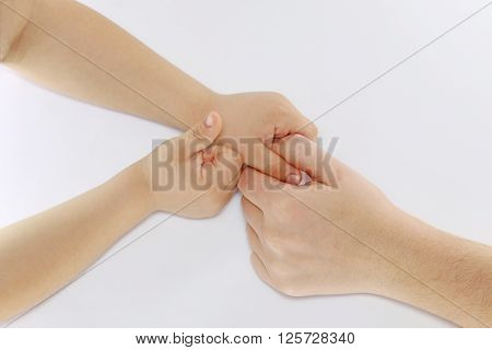 Children little hands touch the child to mamynoi hand.