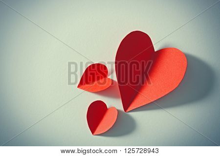 Red paper heart isolated on white background with copy space