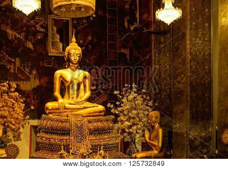 Bangkok, Thailand - December 6, 2015: Golden Buddha statues in a Thai Buddhist temple, Wat Phra Borommathat Maha Chedi, Bangkok, Thailand.