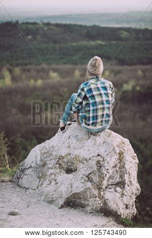 Young woman watching landscape, posing outdoor. Active lifestyle concept. 