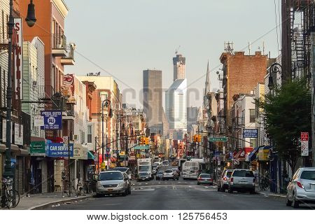 Brooklyn New York - August 16 2014: Greenpoint's Manhattan Ave with Manhattan skyscrapers.