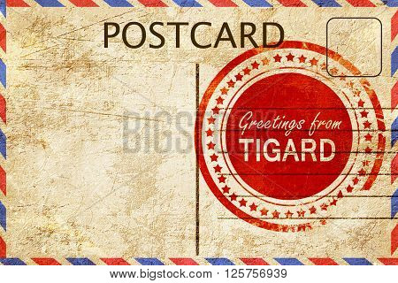 greetings from tigard, stamped on a postcard