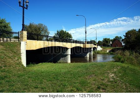 PLAINFIELD, ILLINOIS / UNITED STATES - SEPTEMBER 20, 2015: The DuPage River flows under a bridge in downtown Plainfield.
