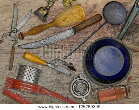 vintage utensils set for cooking over wooden table