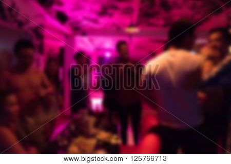 Group Of Young People Having Joyful Dancing In Nightclub Party