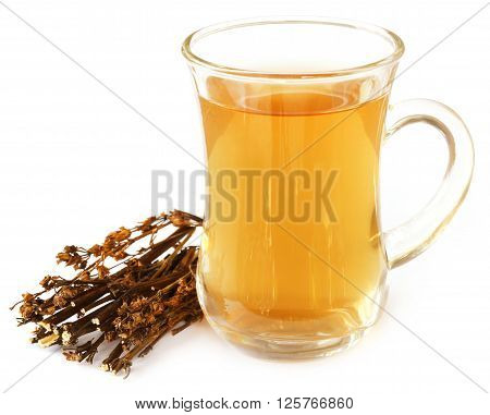 Ayurvedic medicinal Chirata with herbal juice over white background