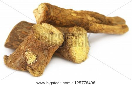 Close up of Medicinal Yastimadhu over white background
